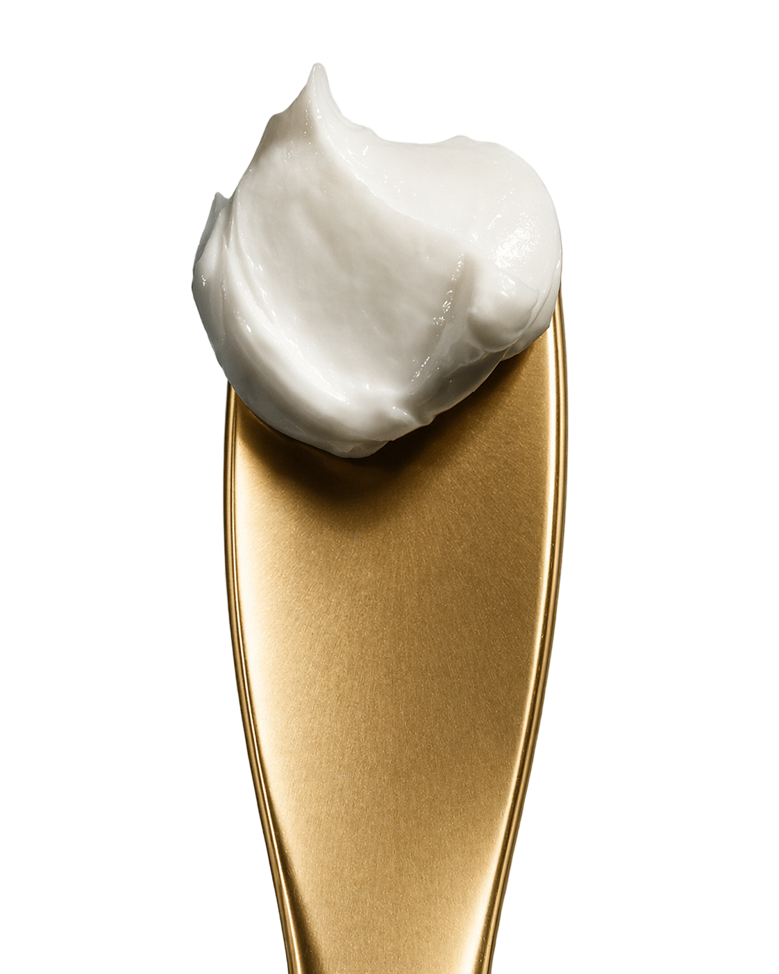 Gold spoon with cream